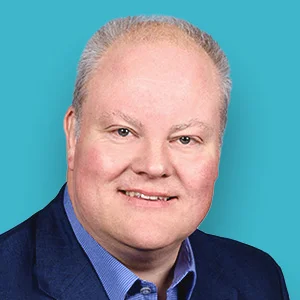 ein Mann in einem blauen Anzug und Krawatte